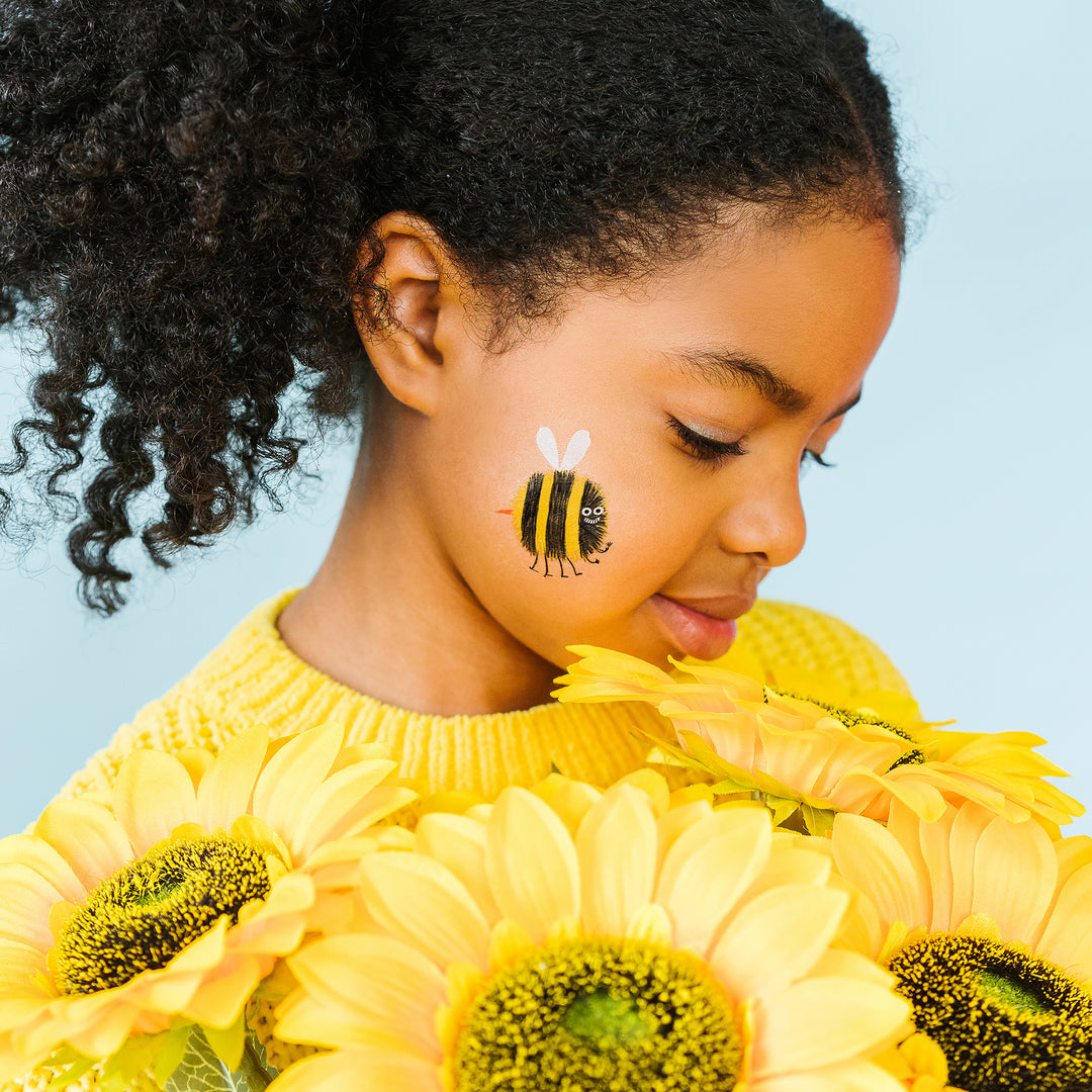 Smiley Yellow And Black Bee Tattly Temporary Tattoo On A Child's Face