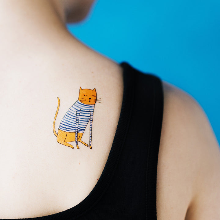 Person Wearing Hand Drawn Cat In A Sweater Temporary Tattoo