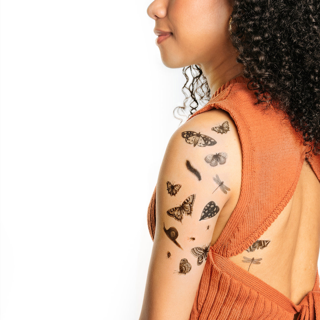 Black And White Insects Tattly Temporary Tattoos On A Person's Arm