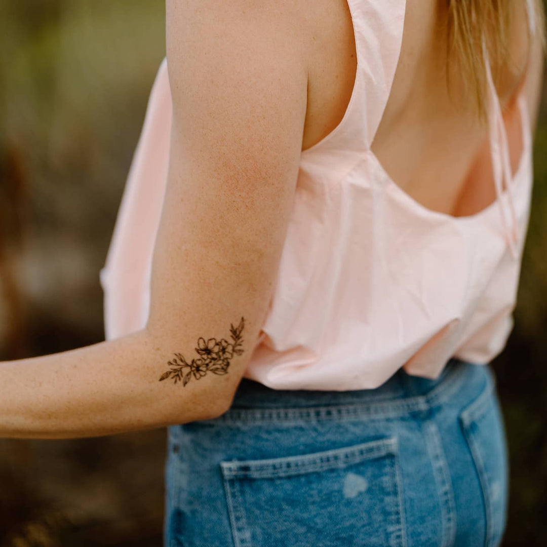 Poppy Bouquet Temporary Tattoos On A Woman's Arm